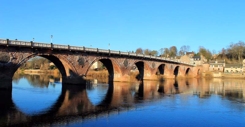 Perth old bridge from the bank of the river Tay