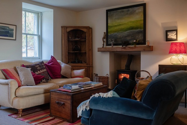 sitting room with roaring fire