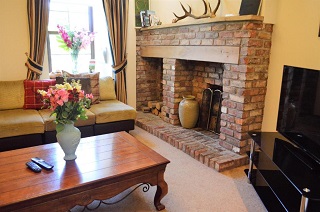 culzean house sittingroom with wood burningstove