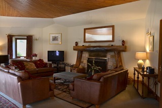 sitting room with large real fire palce