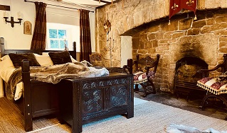 oak bed stone fireplace