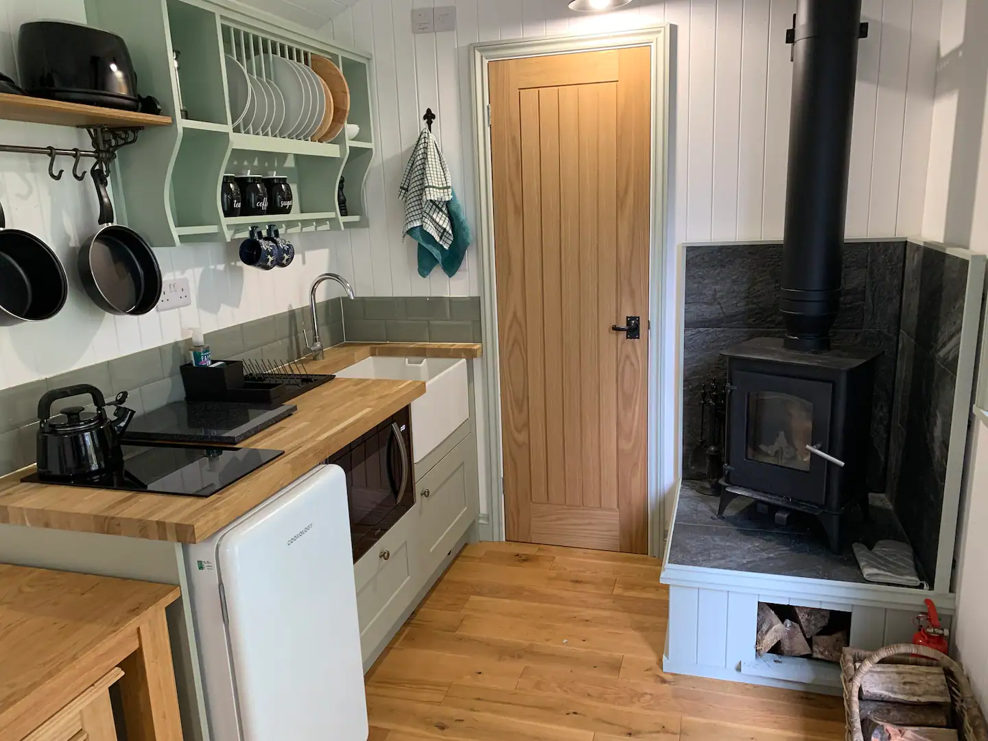 wood burning stove and kitchen