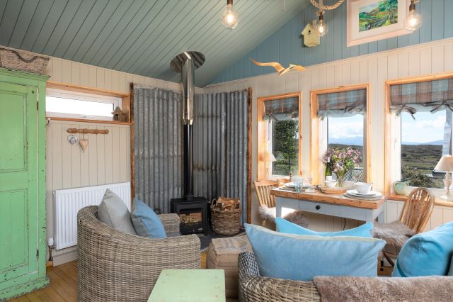 cosy sittingroom with wood burning stove