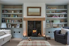 cosy sitting room with wood burning stove