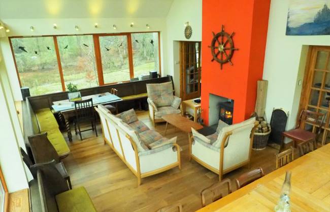 wood burning stove and sitting area with satellite TV and superfast Wifi