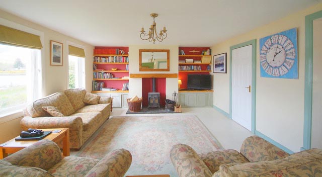 sittingroom with log fire stove - large TV