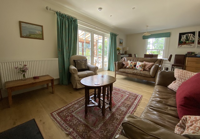 large relaxing sofas and TV