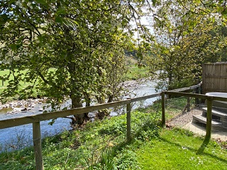 River on Brewlands Estate overlooked by hot tub